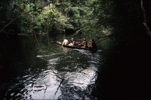 Crossing the river in the canoe.